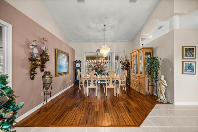 4966 SW 107th Loop, Ocala, FL 34476 - dining room with baseboards, a chandelier, and wood finished floors