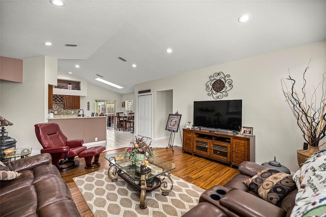 4966 SW 107th Loop, Ocala, FL 34476 - living area featuring vaulted ceiling, wood finished floors, and recessed lighting