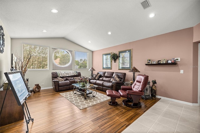 4966 SW 107th Loop, Ocala, FL 34476 - living room featuring vaulted ceiling, wood finished floors, a textured ceiling, baseboards, and recessed lighting