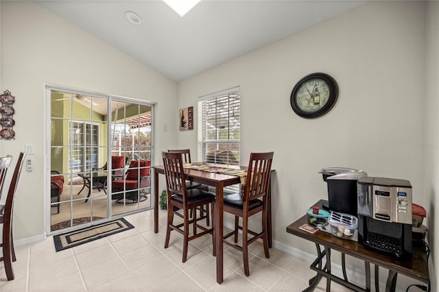 4966 SW 107th Loop, Ocala, FL 34476 - dining area featuring vaulted ceiling, baseboards, and light tile patterned floors