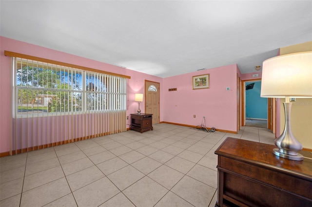 31 N Harrison St, Beverly Hills, FL 34465 - unfurnished living room with light tile patterned floors, baseboards, and visible vents