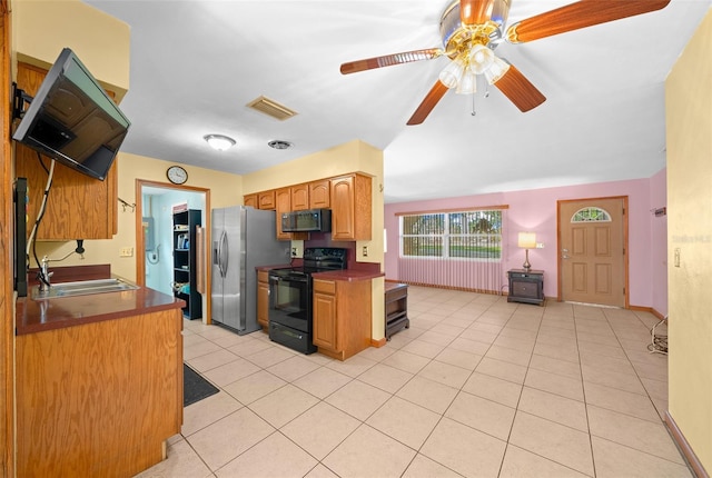 31 N Harrison St, Beverly Hills, FL 34465 - kitchen with a ceiling fan, visible vents, a sink, black appliances, and light tile patterned flooring