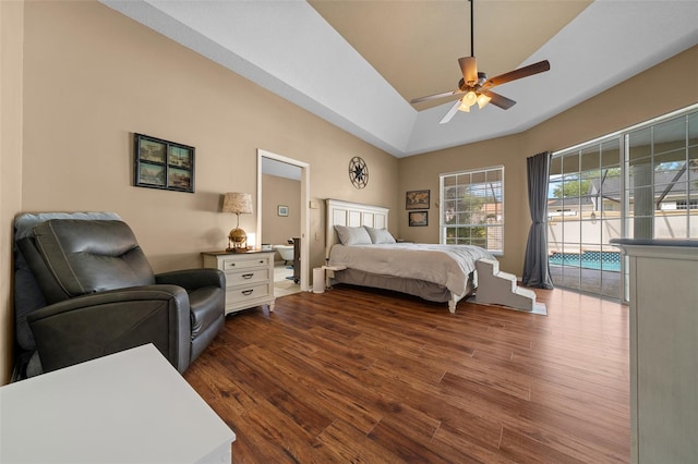 bedroom featuring access to outside, a ceiling fan, and dark wood finished floors