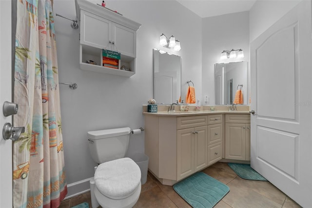 full bath with double vanity, a sink, tile patterned flooring, and toilet