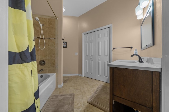 bathroom with tile patterned floors, shower / bath combination with curtain, baseboards, and vanity