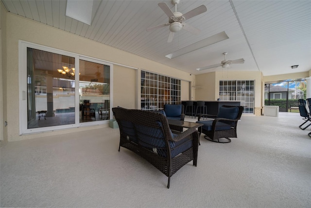 view of patio / terrace featuring ceiling fan and an outdoor living space