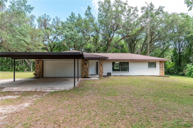 1406 SE Wacahoota Rd, Micanopy, FL 32667 - mid-century home featuring an attached garage, a front lawn, dirt driveway, stone siding, and a carport