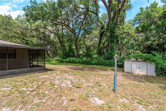 1406 SE Wacahoota Rd, Micanopy, FL 32667 - view of yard with a sunroom, a storage shed, and an outdoor structure