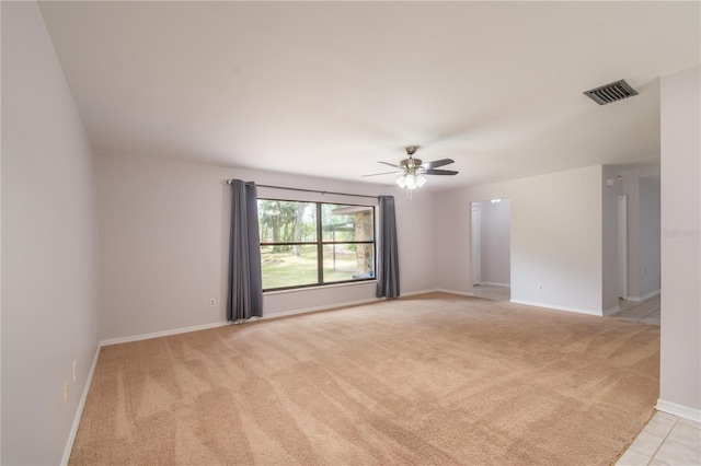 1406 SE Wacahoota Rd, Micanopy, FL 32667 - spare room with light colored carpet, ceiling fan, and baseboards