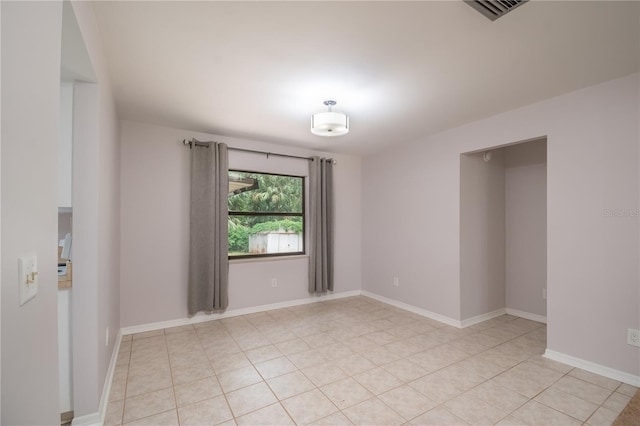 1406 SE Wacahoota Rd, Micanopy, FL 32667 - spare room featuring baseboards and light tile patterned flooring