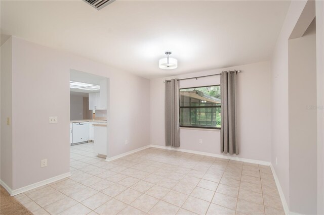 1406 SE Wacahoota Rd, Micanopy, FL 32667 - empty room featuring light tile patterned floors and baseboards