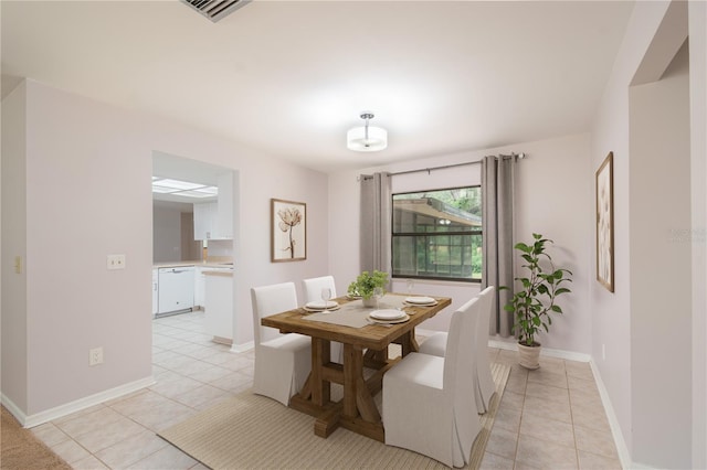1406 SE Wacahoota Rd, Micanopy, FL 32667 - dining space featuring light tile patterned floors and baseboards