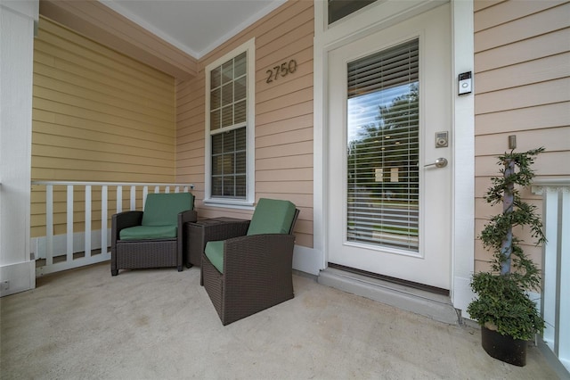 view of exterior entry featuring a porch
