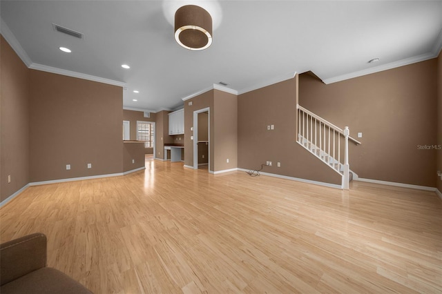 unfurnished living room with crown molding, stairs, baseboards, and light wood finished floors