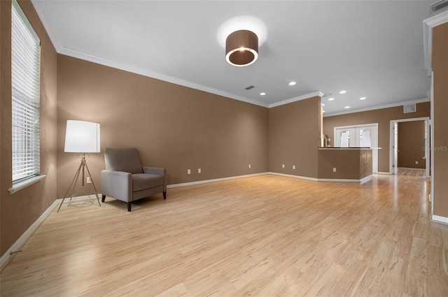unfurnished room with ornamental molding, baseboards, and visible vents