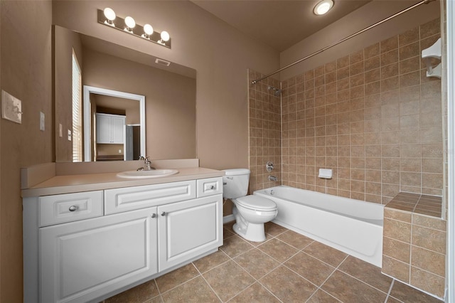 full bathroom with toilet, washtub / shower combination, tile patterned floors, visible vents, and vanity
