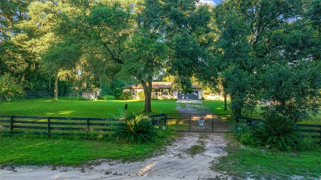 13232 NE 39th Ter, Anthony, FL 32617 - view of property's community with a gate, fence private yard, and a lawn