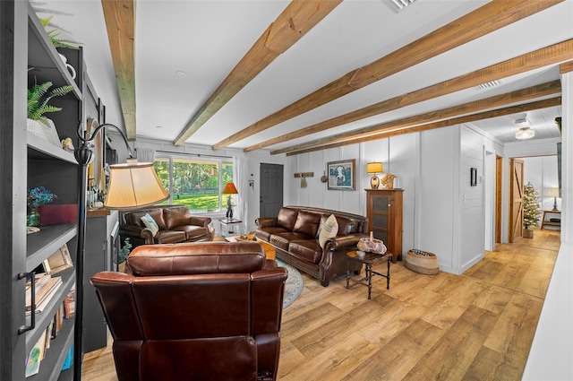 13232 NE 39th Ter, Anthony, FL 32617 - living room featuring light wood finished floors and beamed ceiling