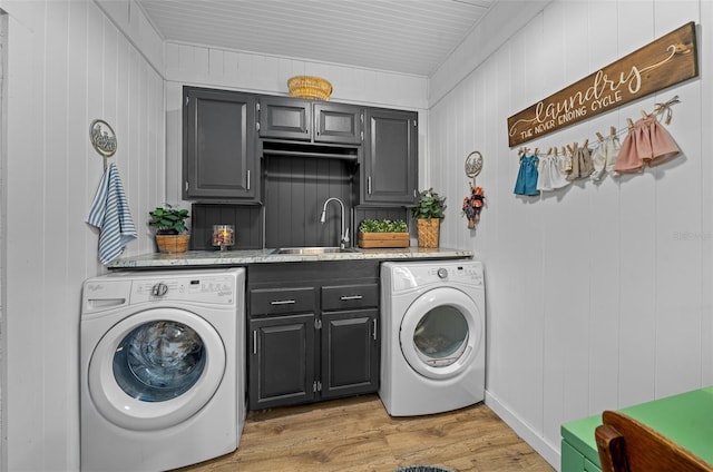 13232 NE 39th Ter, Anthony, FL 32617 - washroom featuring independent washer and dryer, light wood finished floors, cabinet space, and a sink