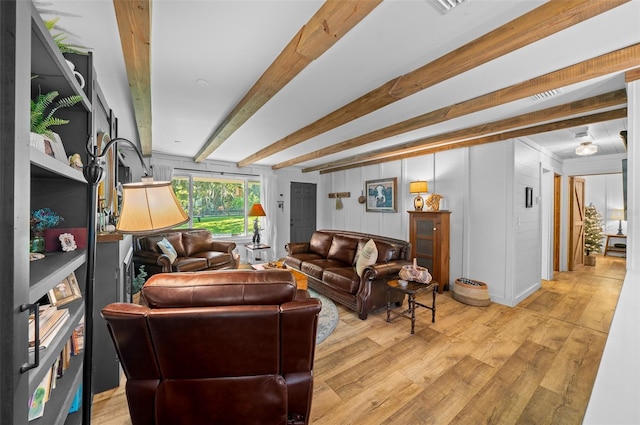 13232 NE 39th Ter, Anthony, FL 32617 - living area with light wood-style floors and beam ceiling