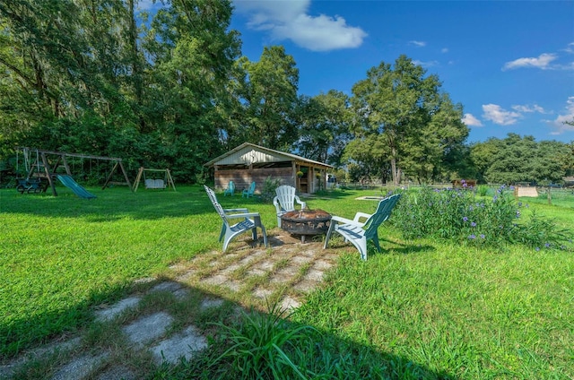 13232 NE 39th Ter, Anthony, FL 32617 - view of yard with a fire pit and a playground