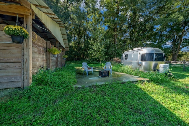 13232 NE 39th Ter, Anthony, FL 32617 - view of yard featuring a patio area, a fire pit, and fence