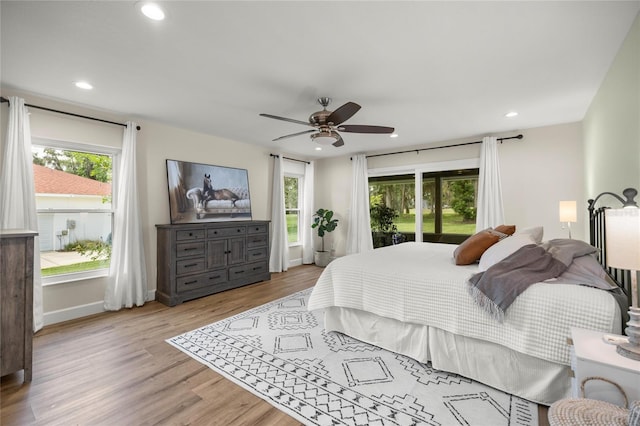 5326 NW 76th Ct, Ocala, FL 34482 - bedroom with wood finished floors, recessed lighting, access to exterior, ceiling fan, and baseboards
