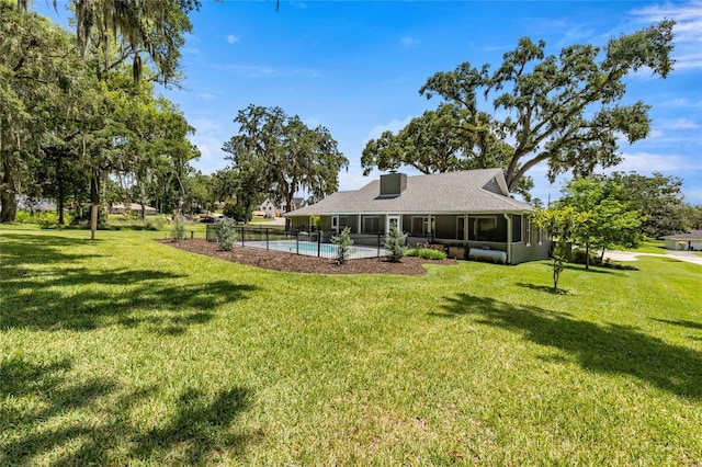 5326 NW 76th Ct, Ocala, FL 34482 - back of house with a yard and an outdoor pool