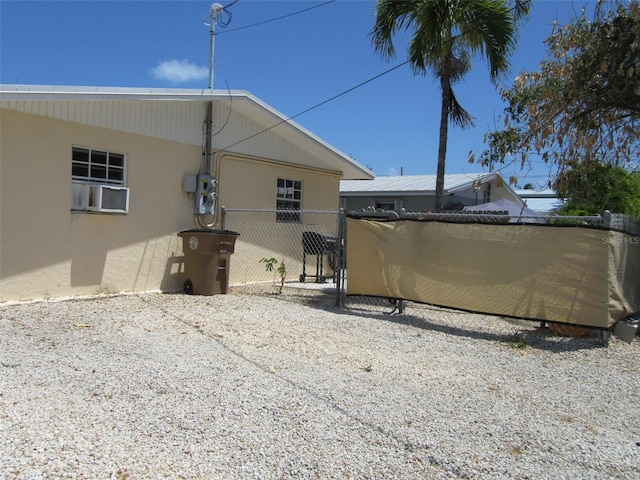 exterior space with fence and cooling unit