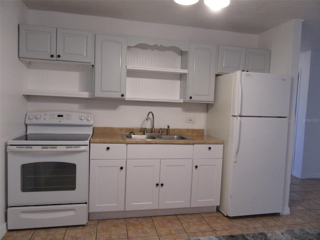 kitchen with a sink, white cabinets, open shelves, and white appliances