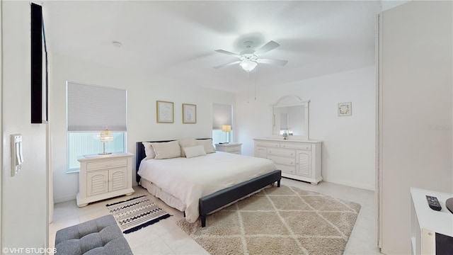 bedroom with baseboards and ceiling fan