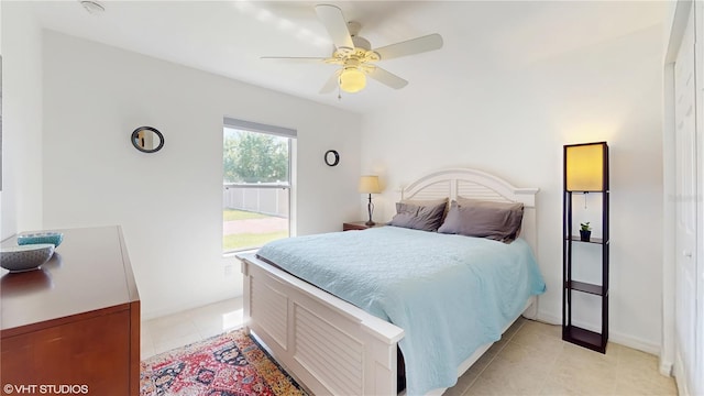 bedroom with light tile patterned floors and ceiling fan