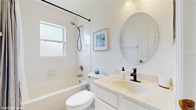 full bath featuring vanity, toilet, and shower / bath combo