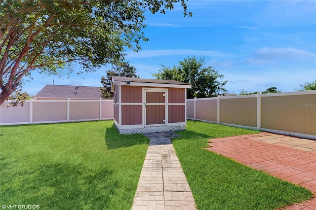 view of shed with a fenced backyard