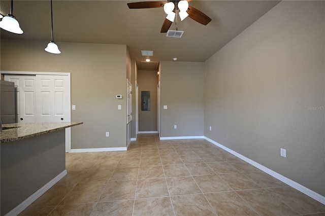 unfurnished living room featuring light tile patterned floors, a ceiling fan, electric panel, visible vents, and baseboards