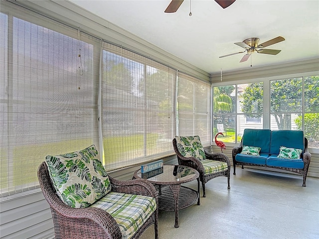 sunroom / solarium with an outdoor living space, ceiling fan, and plenty of natural light