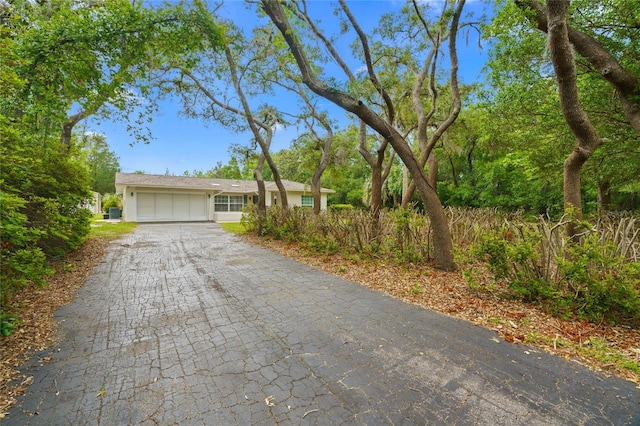 8130 SW 209th Court Rd, Dunnellon, FL 34431 - view of front of home featuring an attached garage, decorative driveway, and stucco siding
