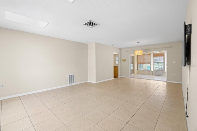 8130 SW 209th Court Rd, Dunnellon, FL 34431 - unfurnished room with light tile patterned floors and baseboards