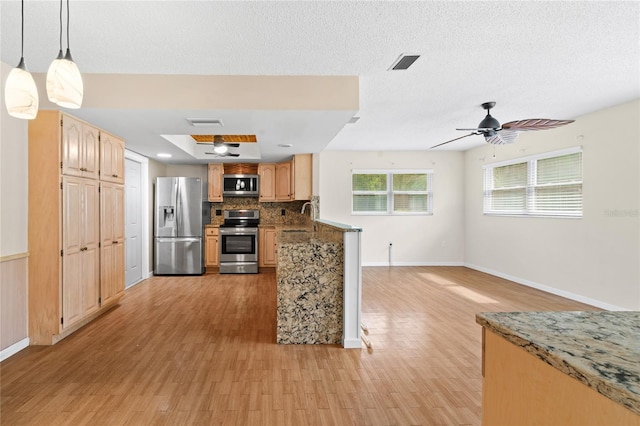 8130 SW 209th Court Rd, Dunnellon, FL 34431 - kitchen featuring stainless steel appliances, light wood-style flooring, and baseboards
