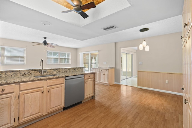 8130 SW 209th Court Rd, Dunnellon, FL 34431 - kitchen with stainless steel dishwasher, a sink, ceiling fan, light brown cabinetry, and a wainscoted wall