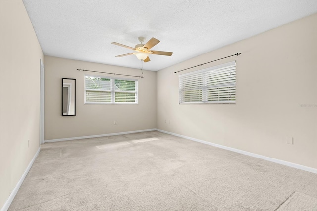 8130 SW 209th Court Rd, Dunnellon, FL 34431 - unfurnished room featuring a ceiling fan, light colored carpet, a textured ceiling, and baseboards