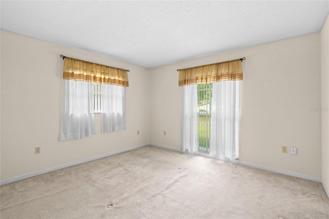 8130 SW 209th Court Rd, Dunnellon, FL 34431 - empty room with carpet floors, a textured ceiling, and baseboards