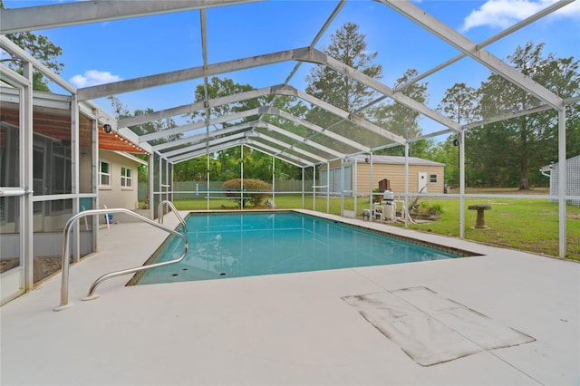 8130 SW 209th Court Rd, Dunnellon, FL 34431 - outdoor pool featuring a storage shed, a patio, an outbuilding, and a lanai