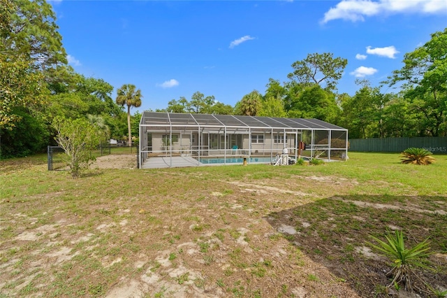 8130 SW 209th Court Rd, Dunnellon, FL 34431 - back of property featuring an outdoor pool and glass enclosure