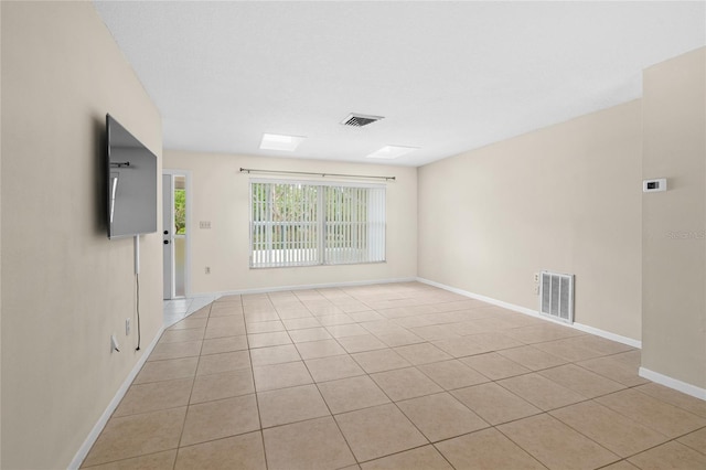 8130 SW 209th Court Rd, Dunnellon, FL 34431 - spare room featuring baseboards and light tile patterned flooring