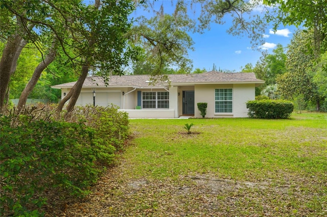 8130 SW 209th Court Rd, Dunnellon, FL 34431 - ranch-style house featuring stucco siding and a front lawn