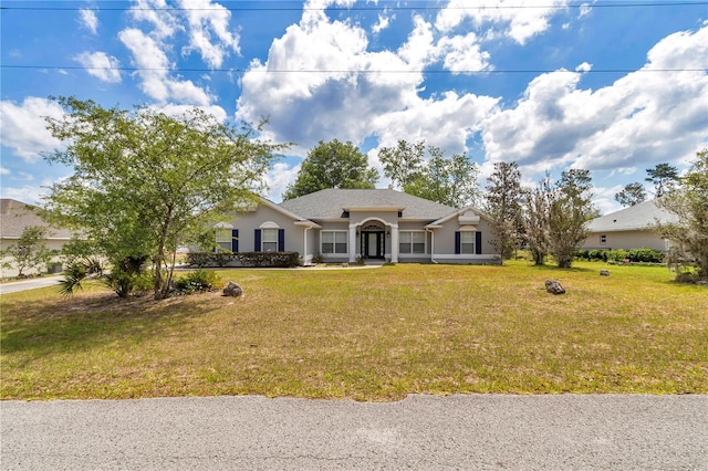 view of front of property featuring a front yard and stucco siding