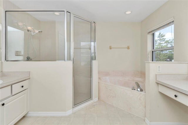 bathroom featuring vanity, tile patterned floors, recessed lighting, a bath, and a stall shower