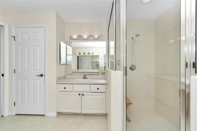 bathroom featuring vanity and a stall shower