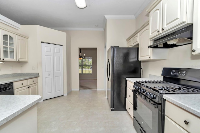 kitchen with ornamental molding, glass insert cabinets, light countertops, under cabinet range hood, and black appliances